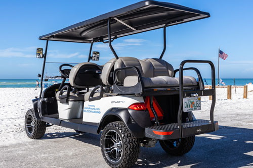 A golf cart with seats and a canopy.